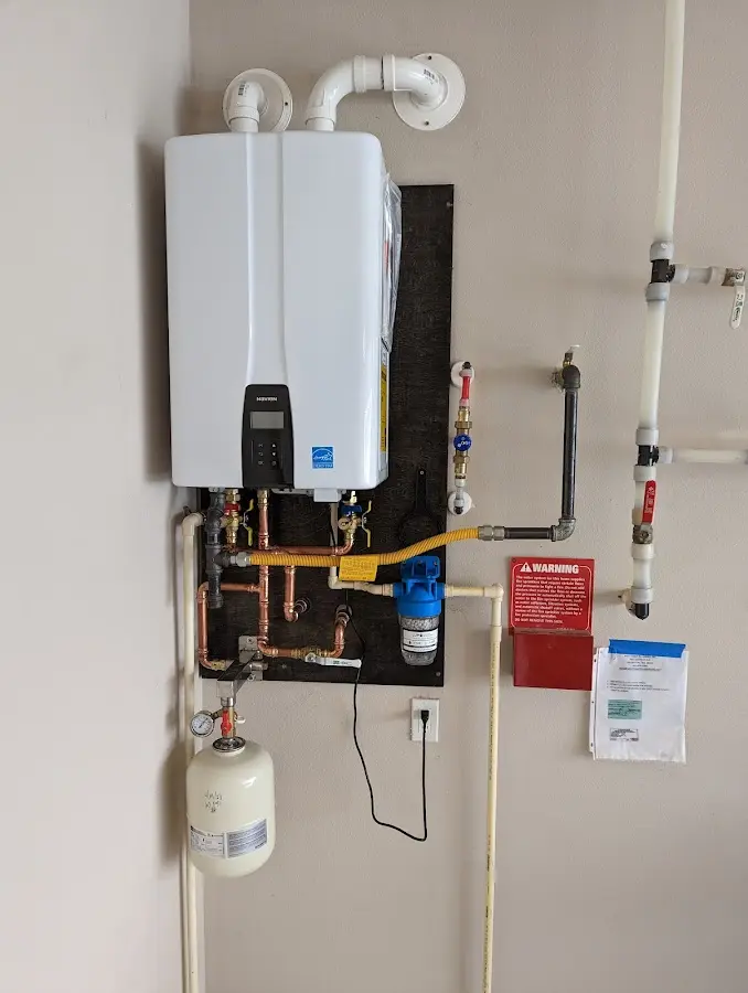 Professional plumber installing copper piping in a Paradise Valley home